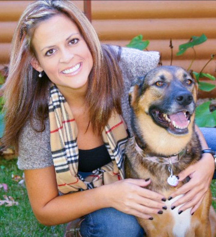 Woman and her shepherd mix dog.