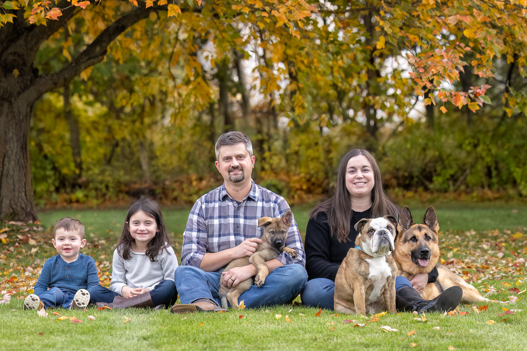 A family of seven pose for a family portrait in their sideboard in Howell, MI.