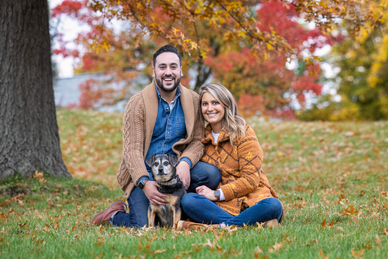 A Fall family portrait of a young couple and their dog in Grand Rapids, MI.